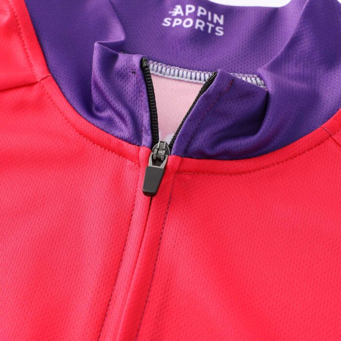 Close up of the top of a zip on the front of a garment