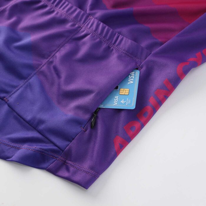 Close up showing a credit card fitting into a zippered pocket on the back of a cycling jersey