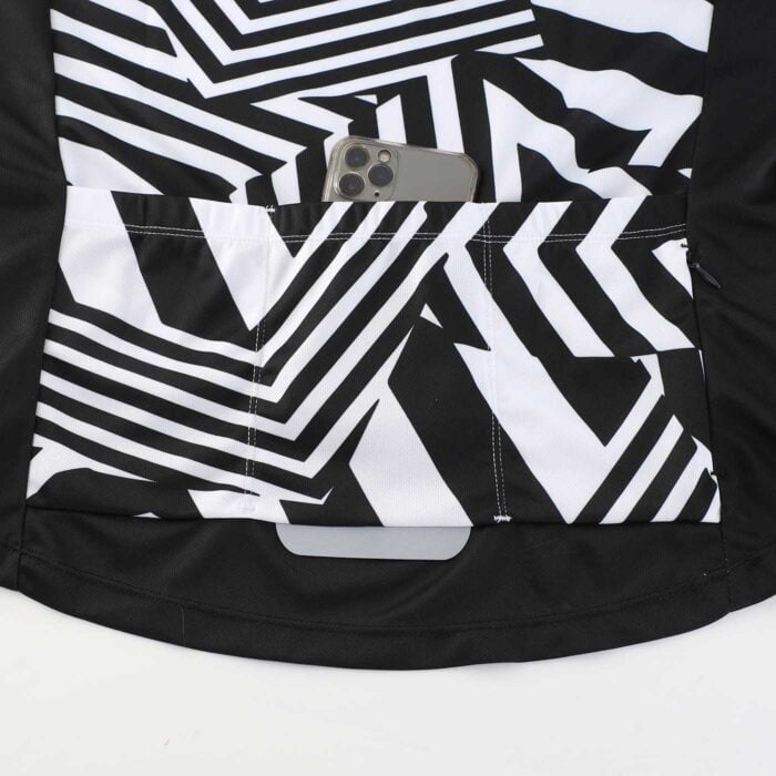 Close up showing 3 lower back pockets; one with a phone in it, on a cycling jersey