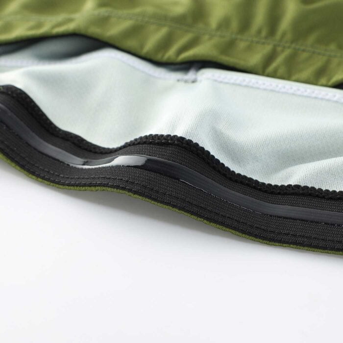 Close up of the silicone strip along the inside bottom hem of a cycling jersey which stops the garment riding up in wear